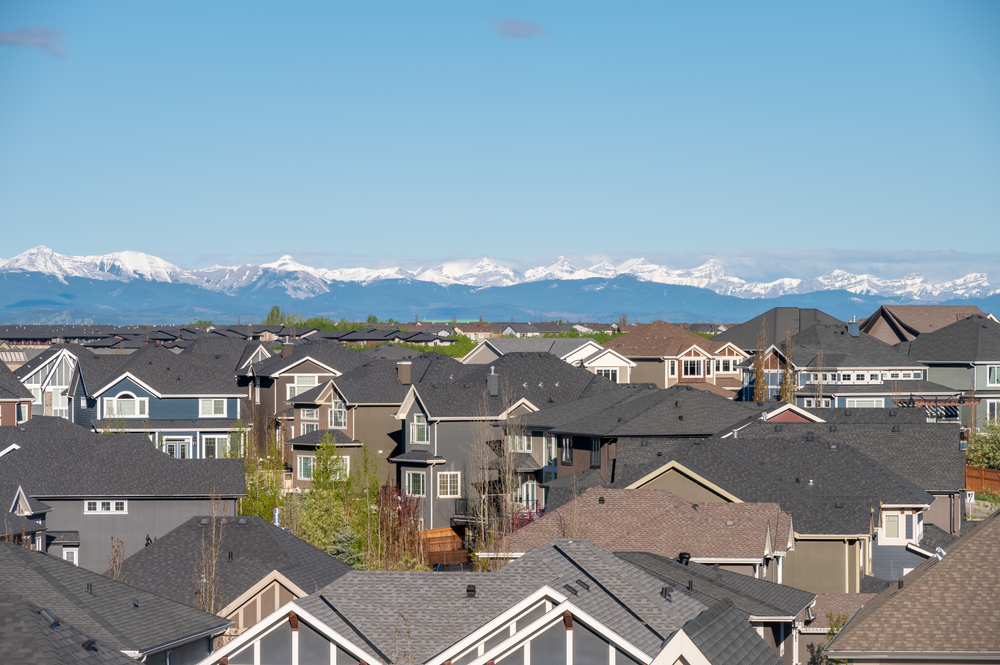 Arial image of Calgary community with mountains in the background
